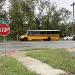 Kansas City, Kansas police investigate a fatal shooting near a school bus struck by gunfire
