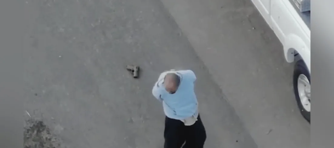 Albuquerque police officers chase a suspect seen in drone footage during an arrest