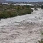 Floodwater moves across a road in the Navajo Nation after heavy rain in New Mexico