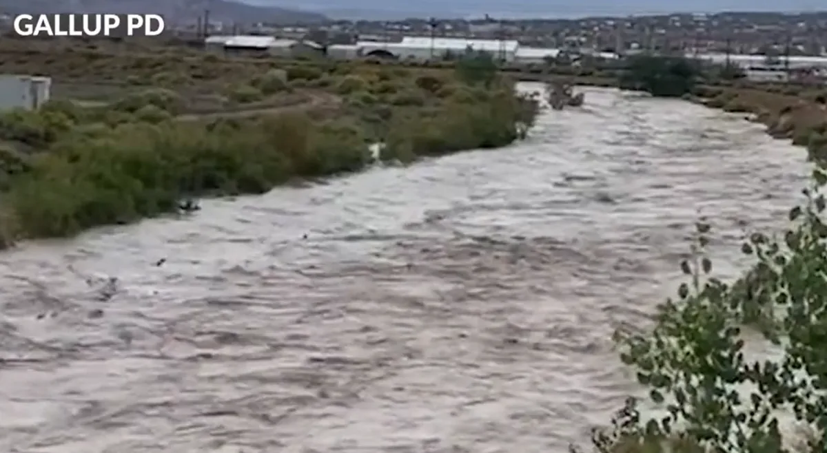 Floodwater moves across a road in the Navajo Nation after heavy rain in New Mexico