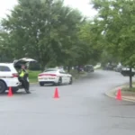 Loudoun County Sheriff's deputies investigate a home in Aldie, Virginia after a fatal shooting