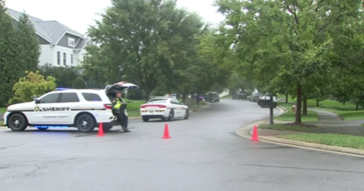 Loudoun County Sheriff's deputies investigate a home in Aldie, Virginia after a fatal shooting
